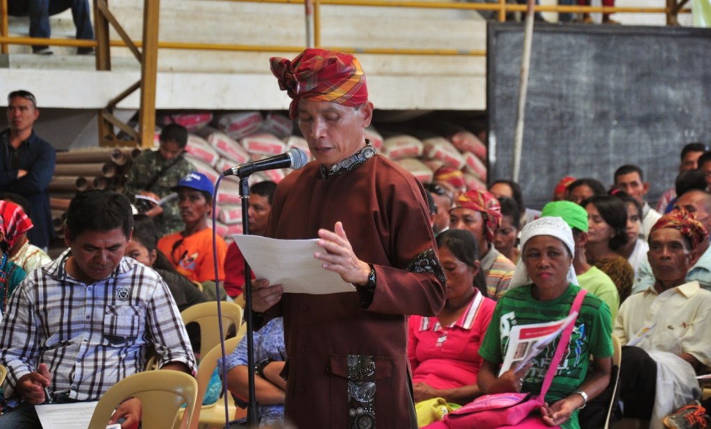 Timuay Santos Magay Unsad reads the position paper during the Congressional Public Hearing on the Bangsamoro Basic Law in Nuro Municipal Gymnasium, Nuro, Upi, Maguindanao on October 22, 2014. Photo from Tri=People Journal Online