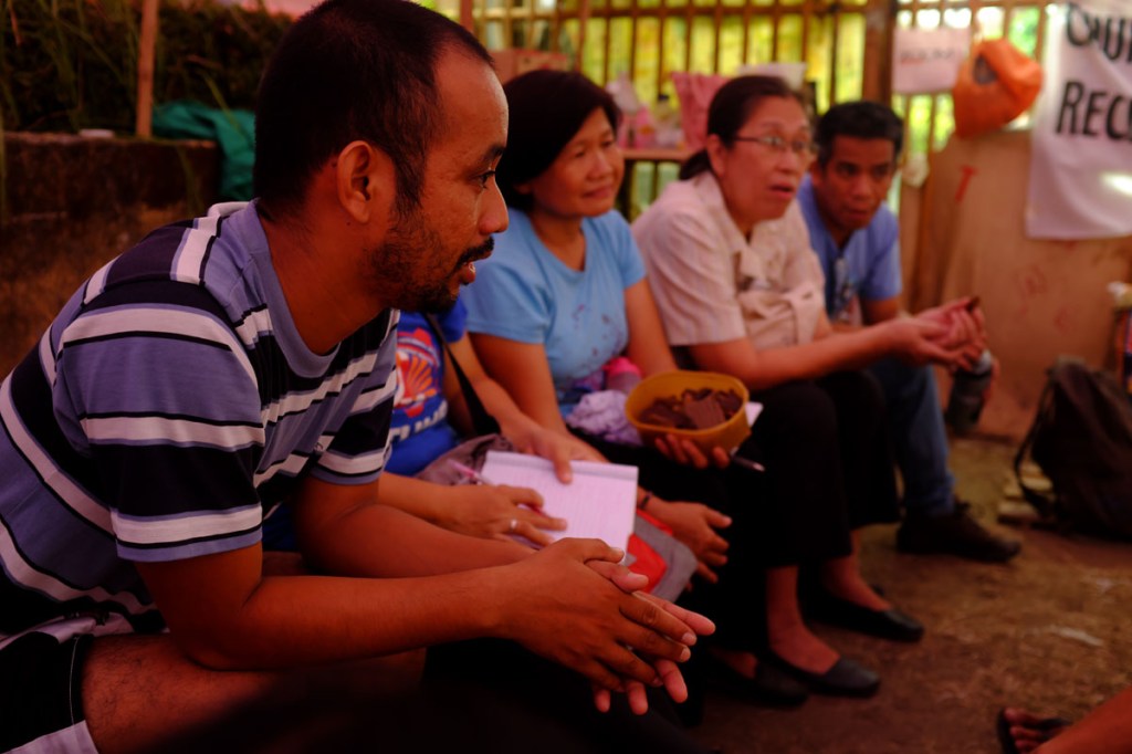 Members of the Solidarity Mission listen to the stories of Tanduay Workers. Photo from CTUHR